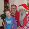 Six-year-old Summer Scott gets a sit down with Santa and Mrs. Claus at the Sarah Mooney Museum.